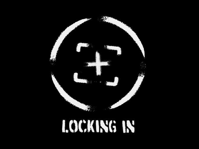 White crosshair symbol with rough edges and the words “LOCKING IN” on a black background.