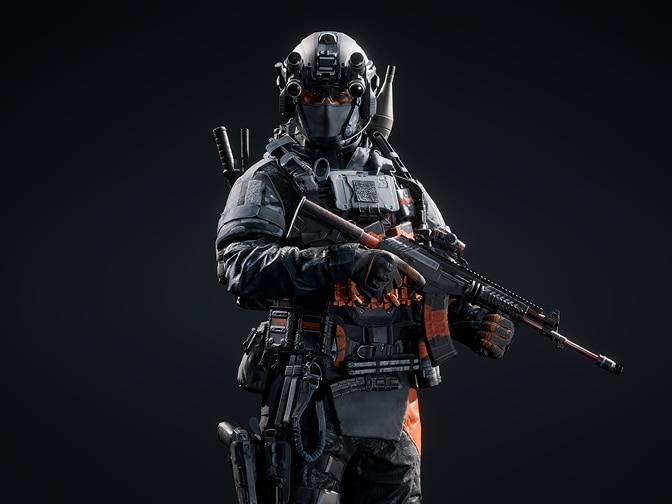 Czarna broń z pomarańczowymi szczegółami.