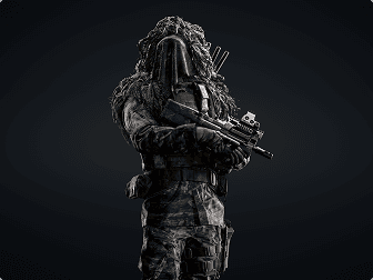 Armed recon soldier in a ghillie suit.