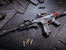 An assault rifle surrounded by ammunition.